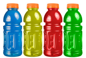 A close up on a set of isolated sports drink bottles.